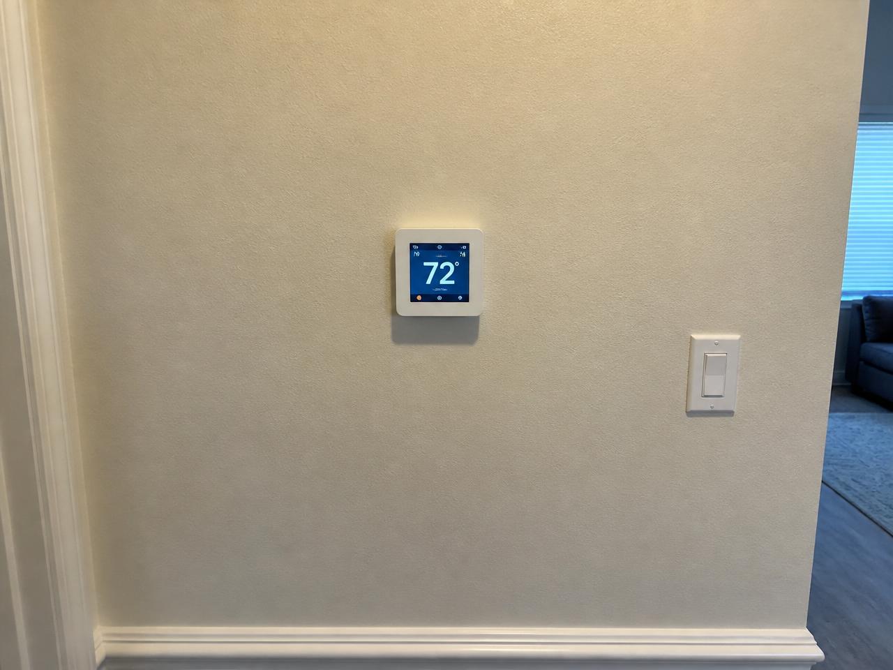 After: Same-location after: new smart thermostat mounted in the exact same spot on the same wall